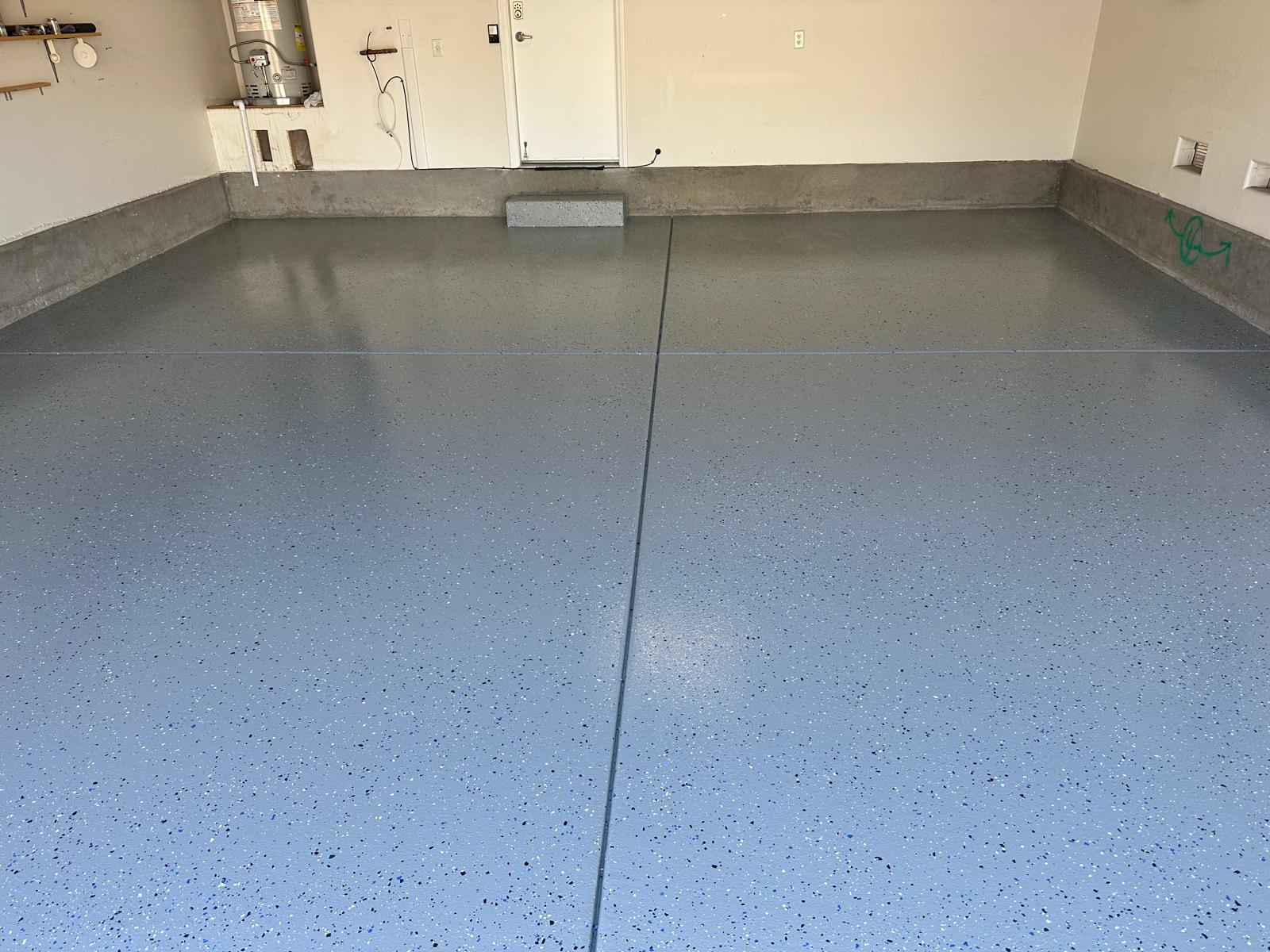 Finished garage floor with a durable flake coating